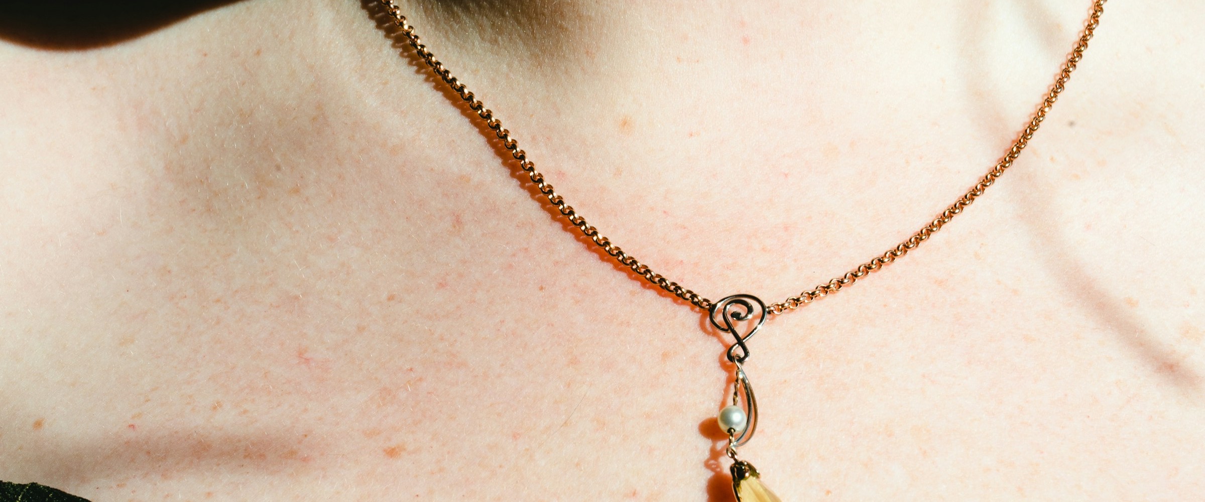 Soft-lit Calytris pearl necklace detail
